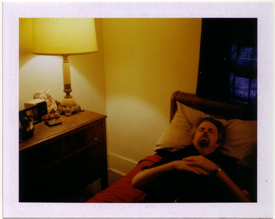 Man on bed and lamp